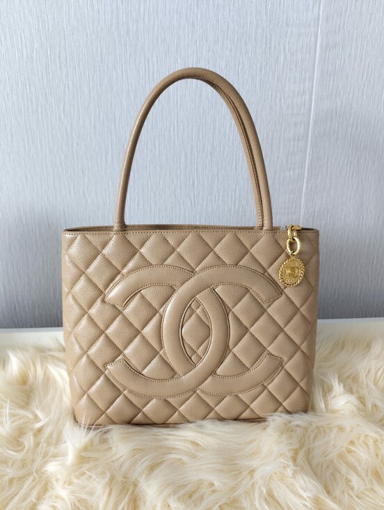 CHANEL Handbags - CHANEL Beige Quilted Leather Tote with CC Emblem